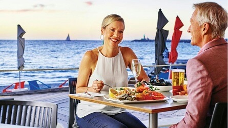 Couple eating at meal at a Fremantle waterfront restaurant
